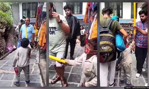 മാസ്‌കെവിടെ?!; കോവിഡ് മാനദണ്ഡങ്ങൾ ലംഘിച്ച ആൾക്കൂട്ടത്തിനെതിരെ വടിയെടുത്ത് കൊച്ചുപോരാളി