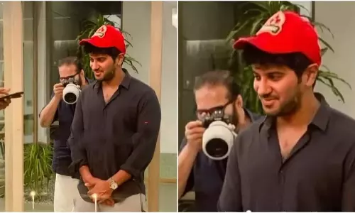 പിറന്നാൾ കേക്ക് മുറിച്ച് ദുൽഖർ, പിറകിൽ ഫോട്ടോഗ്രാഫറായി മമ്മൂട്ടി; ചിത്രം വൈറൽ