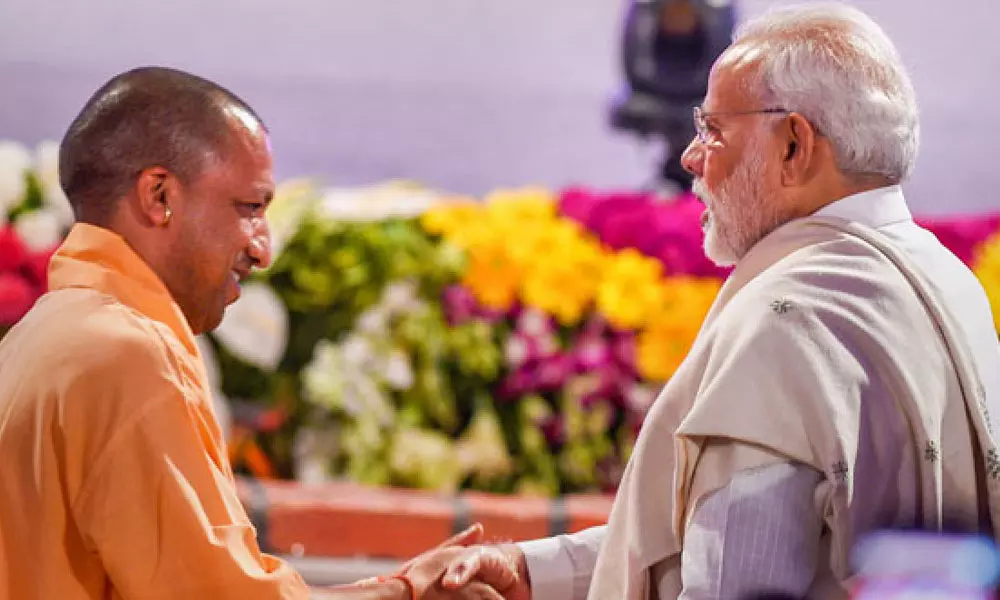 യോഗി ആദിത്യനാഥും പ്രധാനമന്ത്രി നരേന്ദ്ര മോദിയും യോഗി ആദിത്യനാഥും പ്രധാനമന്ത്രി നരേന്ദ്ര മോദിയും