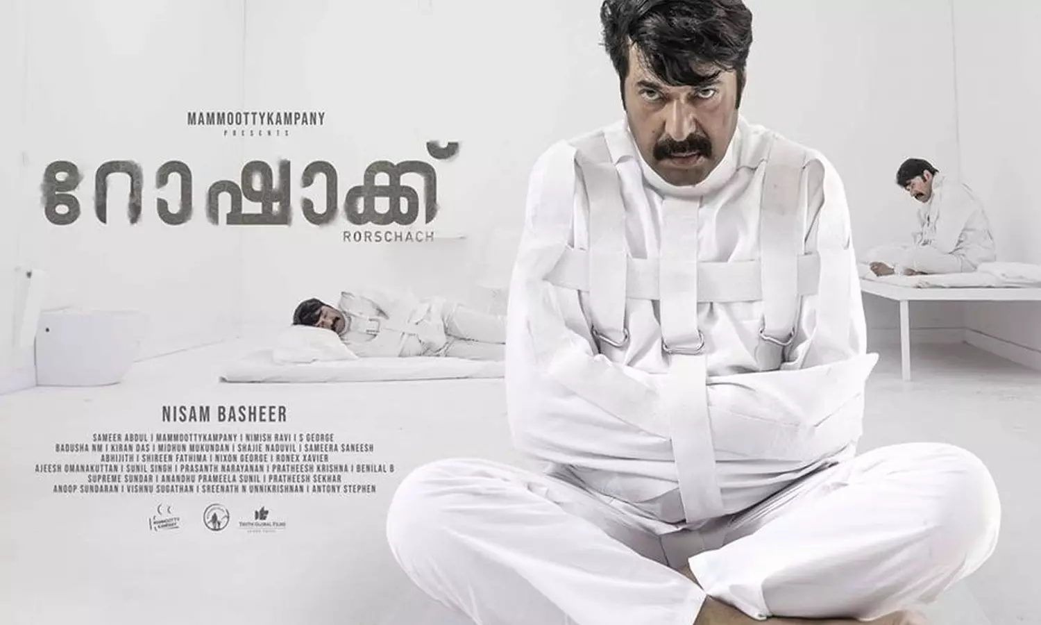 വൈറ്റ് റൂമിൽ കൈകാലുകൾ ബന്ധിച്ച് മമ്മൂട്ടി; നിഗൂഢത നിറച്ച് റോഷാക്ക് പോസ്റ്റർ