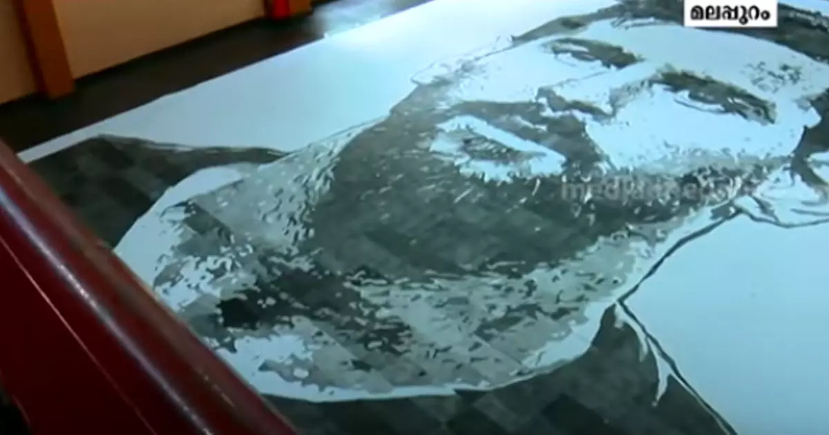 ഓഡിറ്റോറിയത്തോളം വലിപ്പമുള്ള മെസ്സിയുടെ ചിത്രം വരച്ച് മലപ്പുറം സ്വദേശി