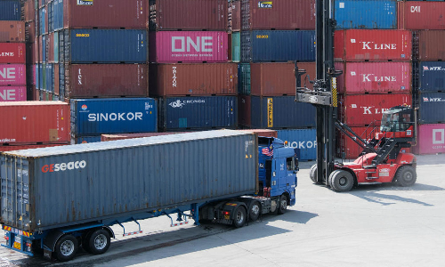 boy hides in shipping container