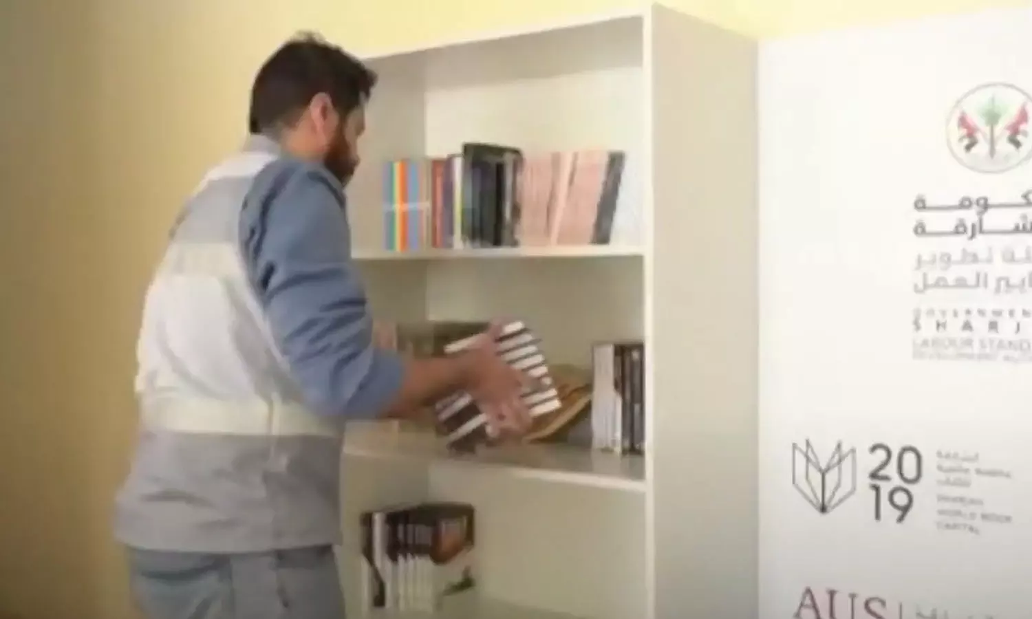 libraries,  Sharjah, labor camps,