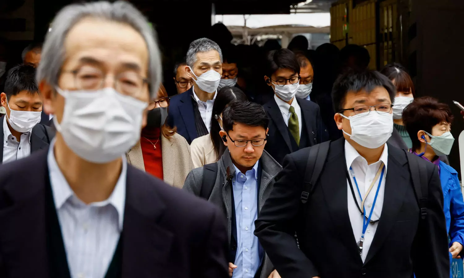 Masks stay put in Japan as 3-year request to wear them ends