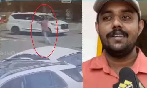 stopped car backed up; Sudheesh, a native of Kozhichena, became the rescuer,latest malayalam news,നിർത്തിയിട്ട കാർ പിന്നോട്ടിറങ്ങി; രക്ഷകനായി കോഴിച്ചെന സ്വദേശി സുധീഷ്‌,