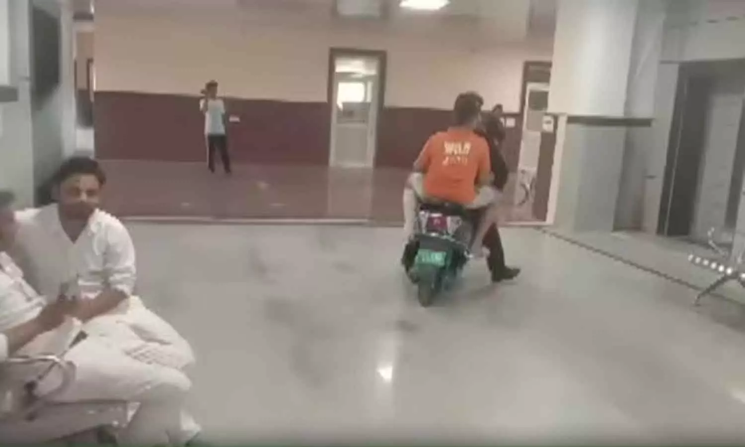 No wheelchair at Kota hospital, man takes injured son to 3rd floor on scooter No wheelchair at Kota hospital, man takes injured son to 3rd floor on scooter