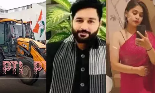 Congress workers drove a bulldozer to BJP leader Priyansh Vishwakarma’s residence demanding demolition action