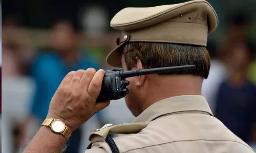 Two policemen have been dismissed after trying to hit a businessman