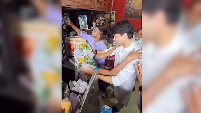Jyotiraditya Scindia meets an elderly woman Jyotiraditya Scindia meets an elderly woman