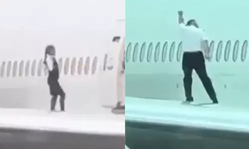 Cabin Crew Dance Atop Plane Wing; Photo Stunt Goes Viral,Swiss International Air Lines,viral video footage,viral video, വിമാനത്തിന്റെ ചിറകിൽ ഡാൻസുമായി കാബിൻ ക്രൂ അംഗങ്ങൾ,വൈറല്‍ വീഡിയോ