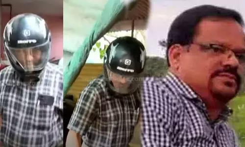 Nandakumar ,Cyber ​​attack on Achu Oommen,Achu Oommen,latest malayalam news,അച്ചു ഉമ്മനെതിരായ സൈബർ ആക്രമണം, മുഖം കാണാതിരിക്കാൻ ഹെൽമെറ്റ് ധരിച്ച് സ്റ്റേഷനിലെത്തി പ്രതി നന്ദകുമാർ, പ്രതി നന്ദകുമാർ,