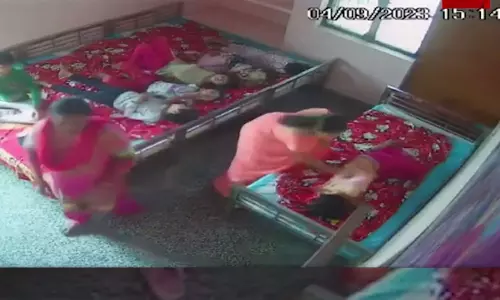 Child shelter official beats girl with slippers in UP Child shelter official beats girl with slippers in UP