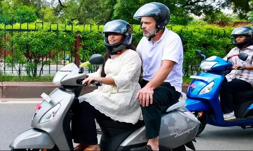 Rahul Gandhi Rides Pillion On College Students Scooter