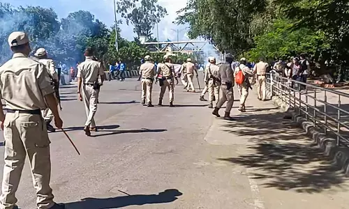 Security personnel stand guard in Imphal