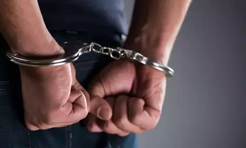 A man who tried to extort money from female student by threatening her by showing her private photos was arrested