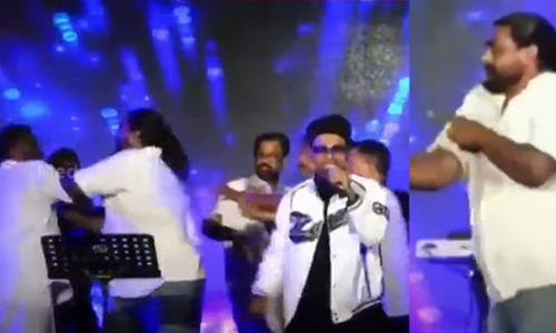 Kannur Corporation Mayor T O Mohanan was beaten up when he tried to stop a young man from dancing on the stage during the Kannur Dussehra program.