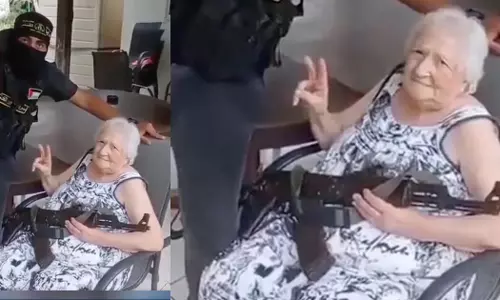 Israeli grandmother holds AK-47 with Hamas fighter, photo goes viral