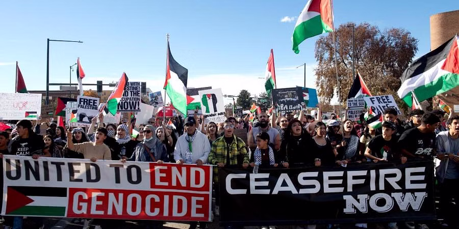 Demonstrators march down Colfax Avenue
