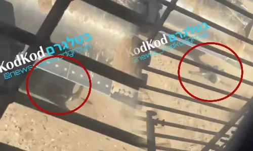 Israeli military vehicle deliberately trampling the body of a dead Palestinian civilian who died trying to cross Israel’s “safe corridor” in Gaza, Israel mutilates dead Palestine civilian