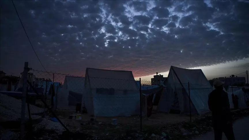 Palestinians are seen around their makeshift tents Palestinians are seen around their makeshift tents