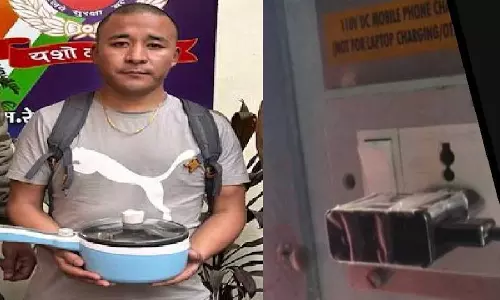 Man plugs electric kettle into train
