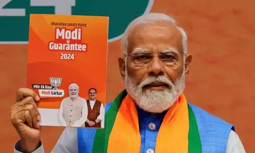 PM Modi holds bjp manifesto 2024