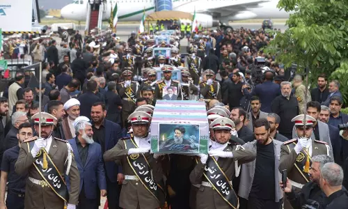 Iranian soldiers carrying the coffin of Iranian President Ebrahim Raisi