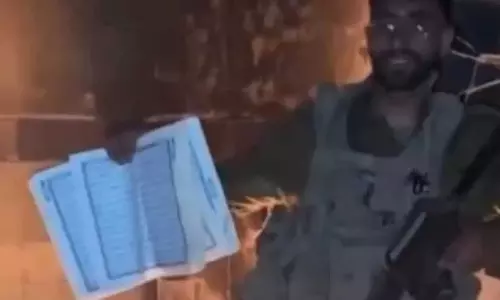 israel soldier firing quran