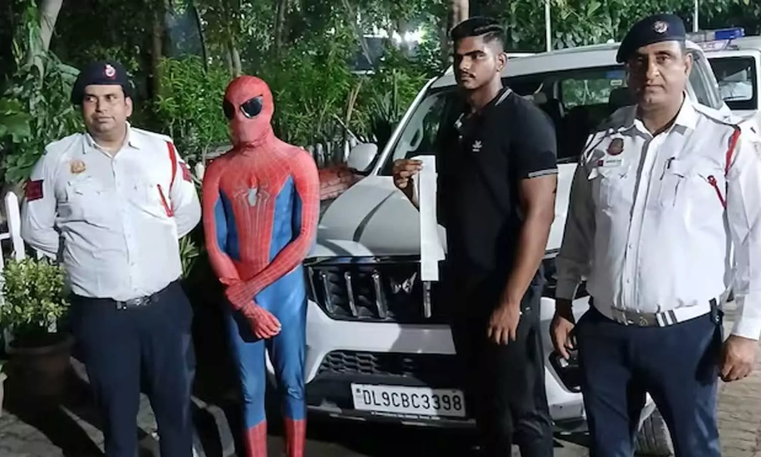stunt in a car wearing Spider-Man dress; Police with action stunt in a car wearing Spider-Man dress; Police with action
