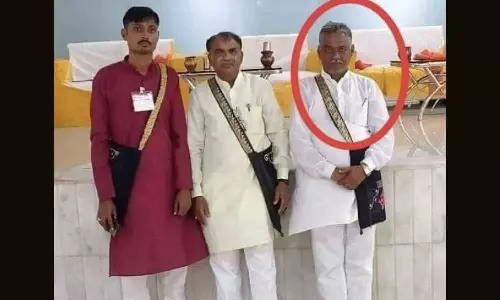 An image making the rounds on social media. Circled is Govind Natt, photographed with former BJP minister Arjunsinh Chauhan.