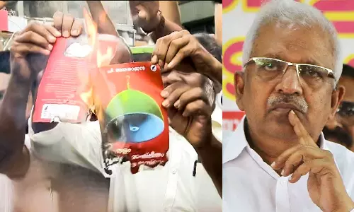 PDP burns Book of P Jayarajan Over Controversial Statements Against Maudany