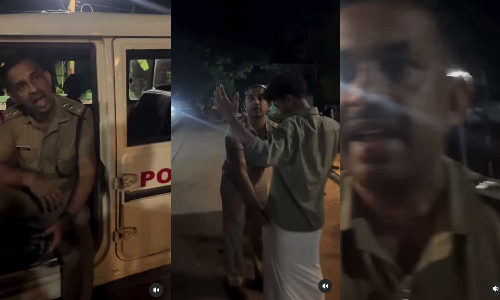 Police Officer Threatens Youths in Night at Bus Stop Kozhikode Police Officer Threatens Youths in Night at Bus Stop Kozhikode