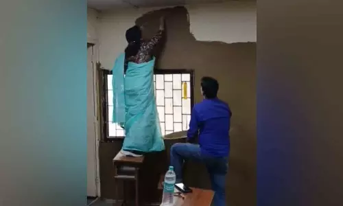 DU College principal coats classroom with cow dung