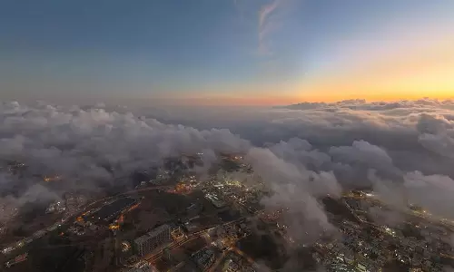 Cloud-shrouded mountains; Asir province presents winter scenery