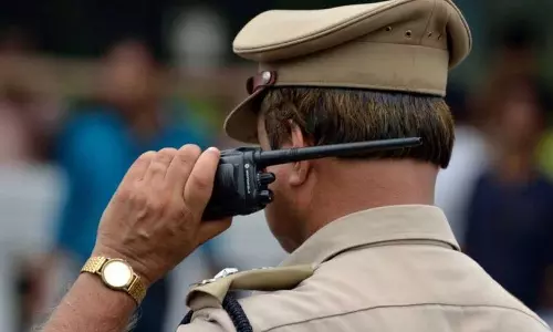 Police officers suspended for accepting payment for settlement in financial fraud case