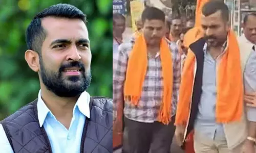 കർണാടകയിൽ കോൺഗ്രസ് എംഎൽഎ കാവി ഷാളണിഞ്ഞ് ആർഎസ്എസ് ജാഥയിൽ‌