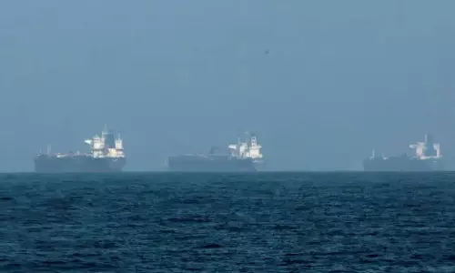 Three vessels hit by projectiles in Strait of Hormuz