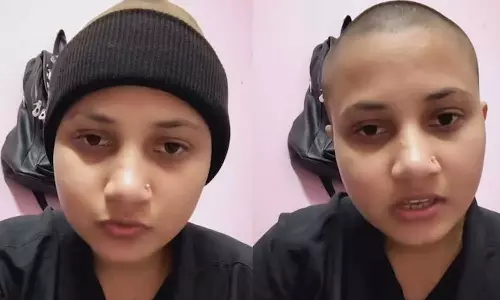 വി​വാ​ഹം ക​ഴി​ക്കാൻ നി​ർ​ബ​ന്ധി​ച്ച് വീ​ട്ടു​കാ​ർ: ര​ക്ഷ​പ്പെ​ടാ​നായി ത​ല മൊ​ട്ട​യ​ടി​ച്ച് യു​വ​തി; വീ​ഡി​യോ വൈറൽ