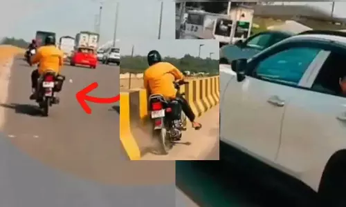 ഓടുന്ന കാറിലിരുന്ന് വാട്ടര്‍ ബലൂണ്‍ പ്രാങ്ക്; ബൈക്ക് യാത്രികന്‍ രക്ഷപ്പെട്ടത് തലനാരിഴക്ക് ,നടപടിയെടുത്ത് പൊലീസ്