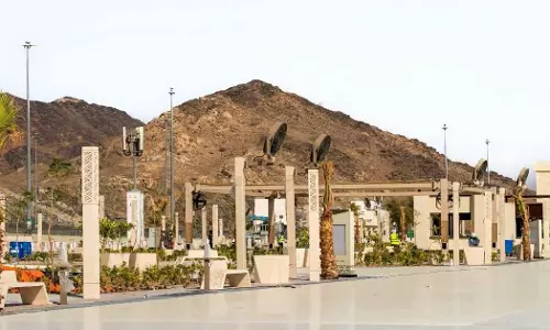 Umbrellas and water mist fans; 66,000 sq m rest center developed for pilgrims