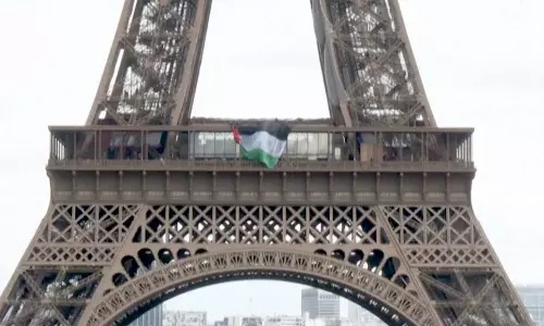 Activists hang Palestinian flag on the Eiffel Tower for Nakba Day
