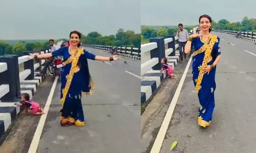 റീൽ എടുക്കുന്നതിനിടെ കുഞ്ഞ് പാലത്തിന്റെ അരികിലേക്ക്; രക്ഷകനായി യുവാവ് റീൽ എടുക്കുന്നതിനിടെ കുഞ്ഞ് പാലത്തിന്റെ അരികിലേക്ക്; രക്ഷകനായി യുവാവ്