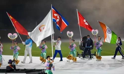 Colorful closing ceremony for the Asian Games; Neeru Dhanda carries the Indian flag; Qatar to host the next edition. Colorful closing ceremony for the Asian Games; Neeru Dhanda carries the Indian flag; Qatar to host the next edition.
