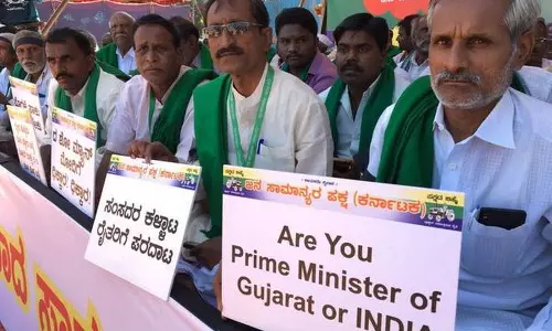 മോദിയുടെ റാലിക്കിടെ കര്‍ഷകരുടെ പ്രതിഷേധം