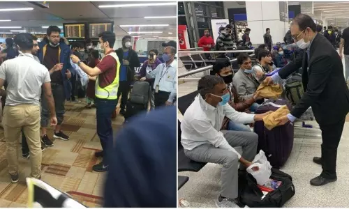 യാത്രക്കാര്‍ക്ക് ഭക്ഷണവും മാസ്കും നല്‍കി ഡല്‍ഹി എയര്‍പോര്‍ട്ട് ജീവനക്കാര്‍; കയ്യടിച്ച് സോഷ്യല്‍ മീഡിയ